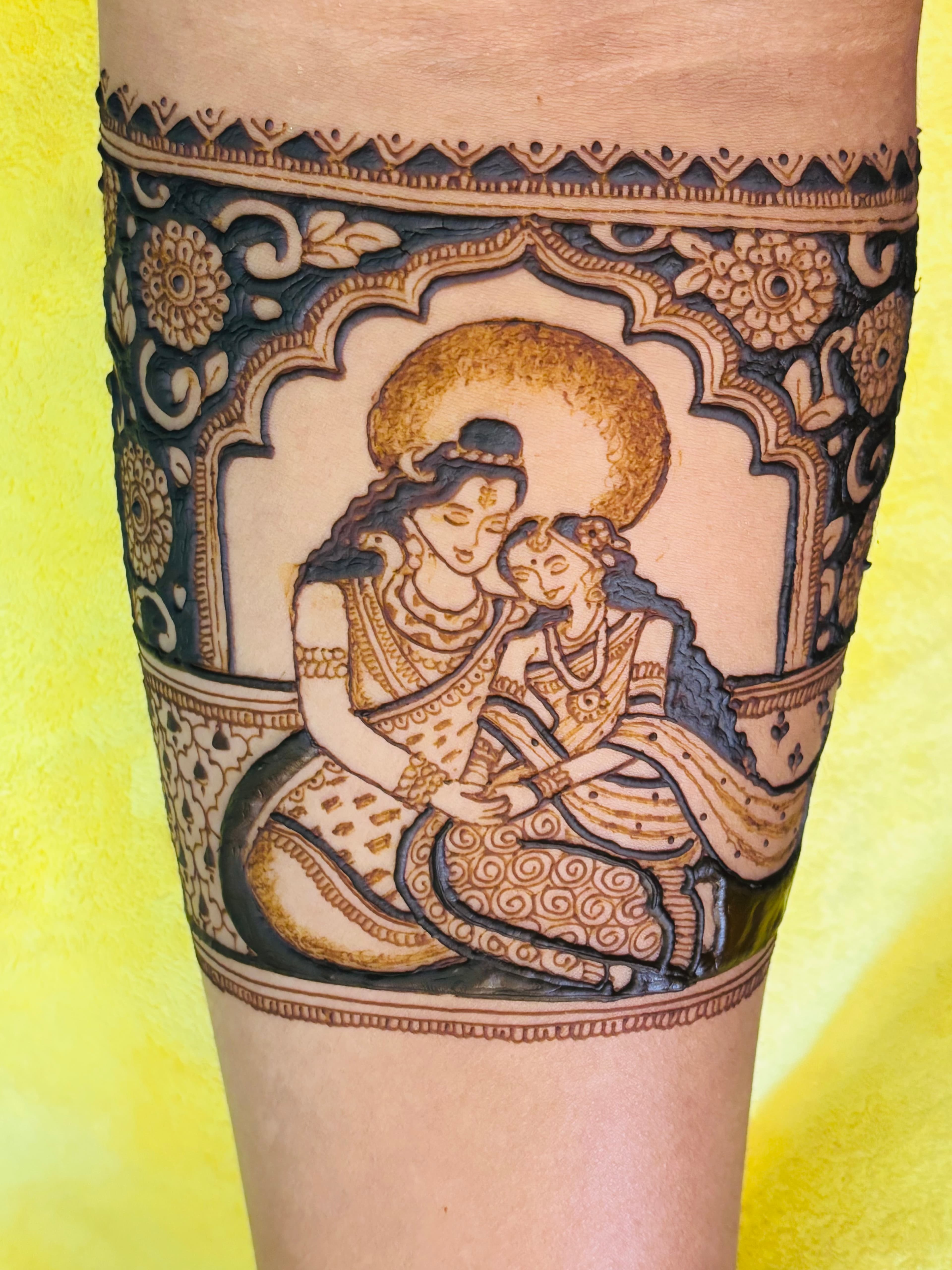 Divine Radha Krishna bridal portrait mehendi design by Royal Hands By Dhanashree